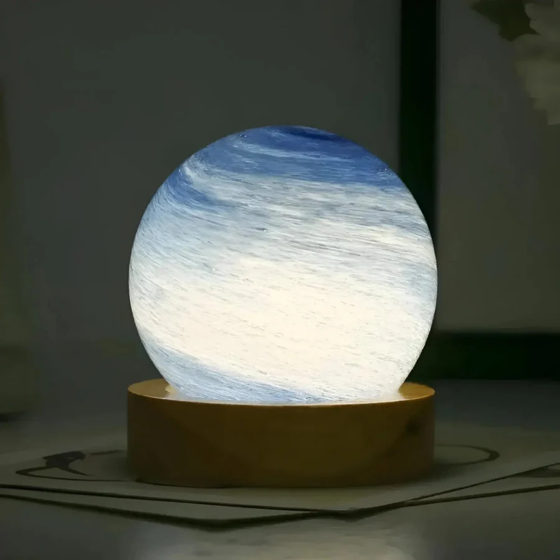 Elegant 3D Planet Lamp with a captivating cosmic glow, supported by a sturdy wooden base. Ideal nightlight & decor.