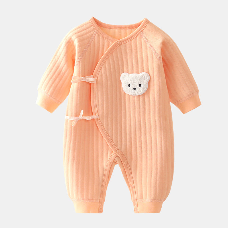 Baby on a blanket wearing a snug cotton bear outfit, perfect for autumn, unisex baby