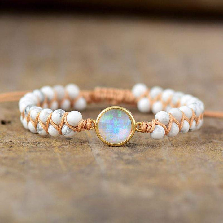 Close-up of a women's Amethyst and Opal healing stone bracelet, ideal for meditation.