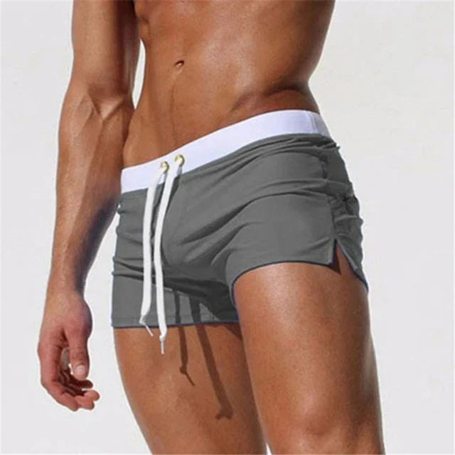 Side view of Arlan men's swim shorts in red, highlighting breathable material & beachwear style