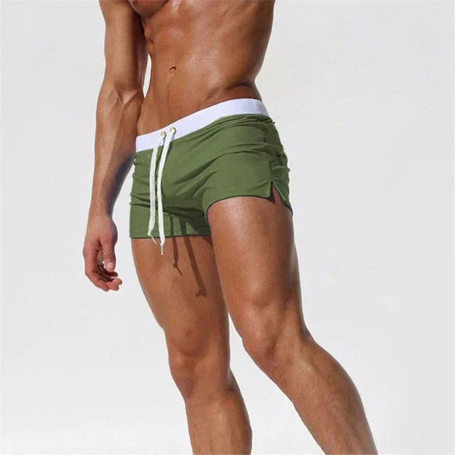 Folded Arlan men's board shorts in various colors, quick-drying for men's swimwear collection