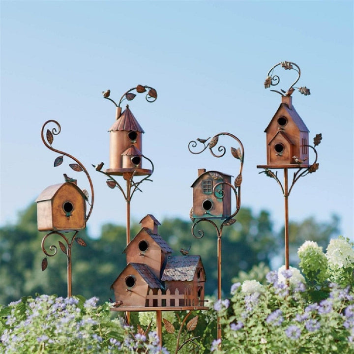 Artistic metal birdhouse garden stake, charming outdoor decor for wildlife & rustic gardens.
