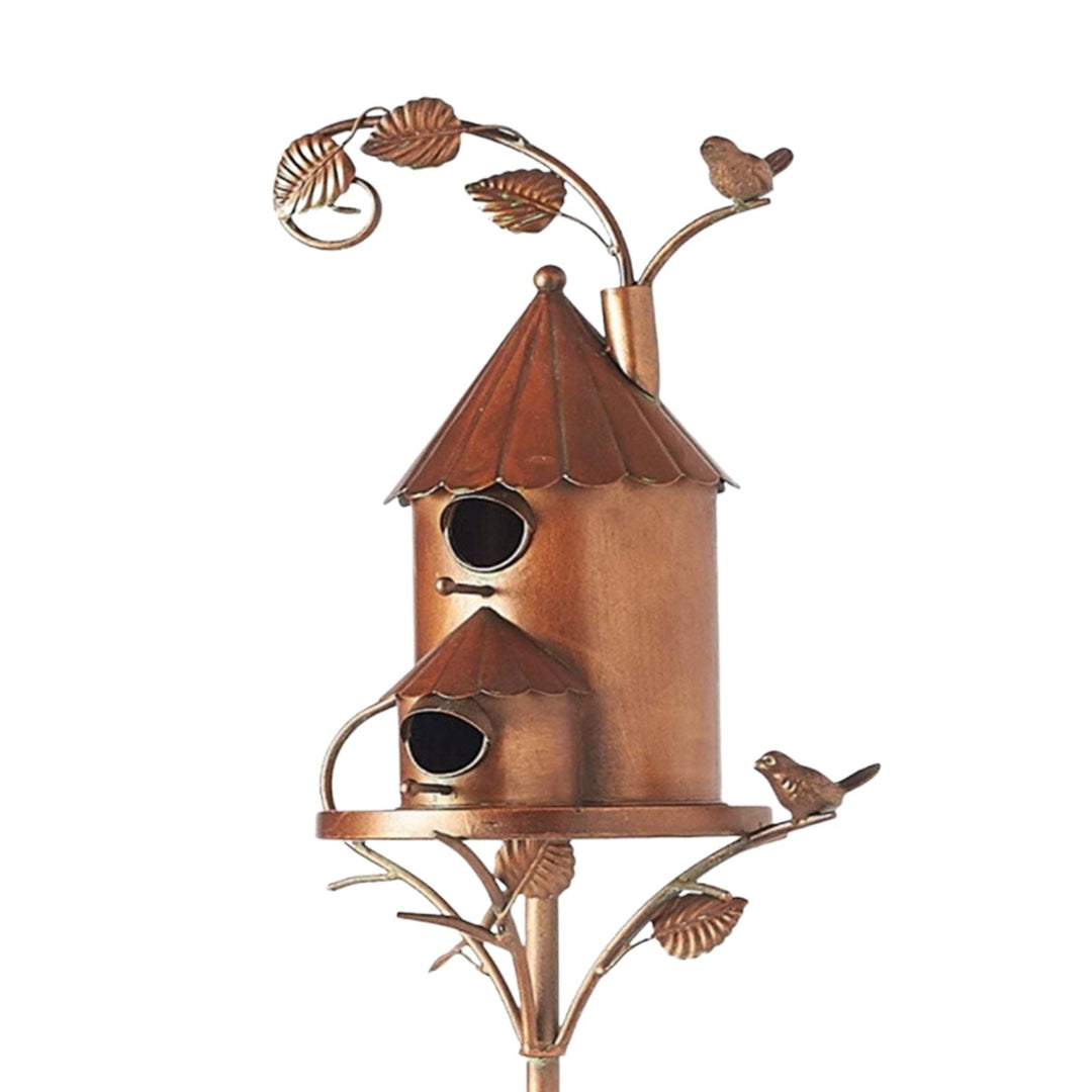 Rustic metal birdhouse garden stake, unique artistic outdoor living accent for birds.