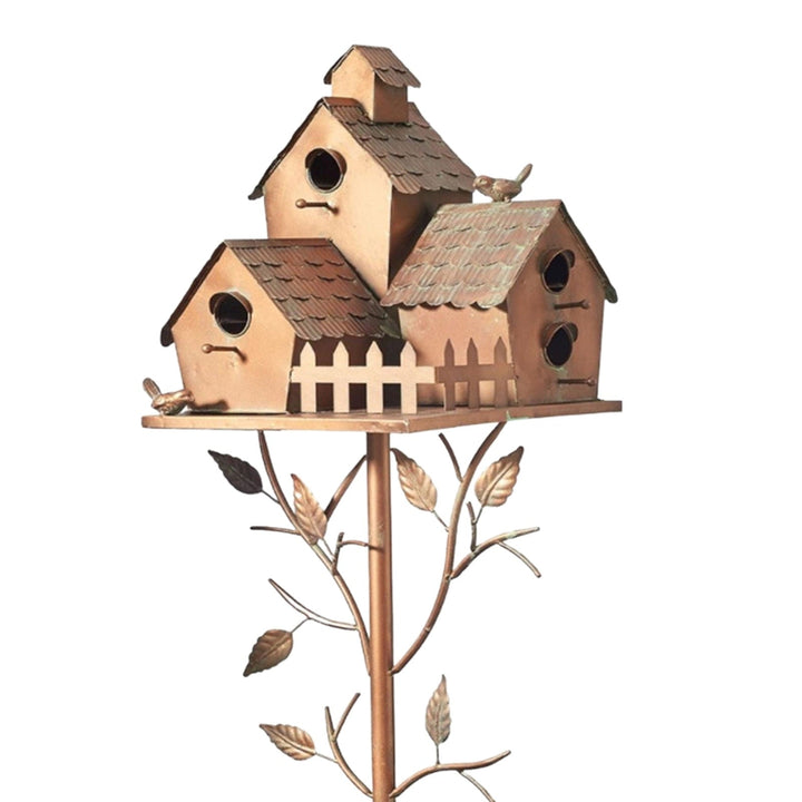 Elegant metal birdhouse garden stake, artistic outdoor decor, perfect as a wildlife feeder.