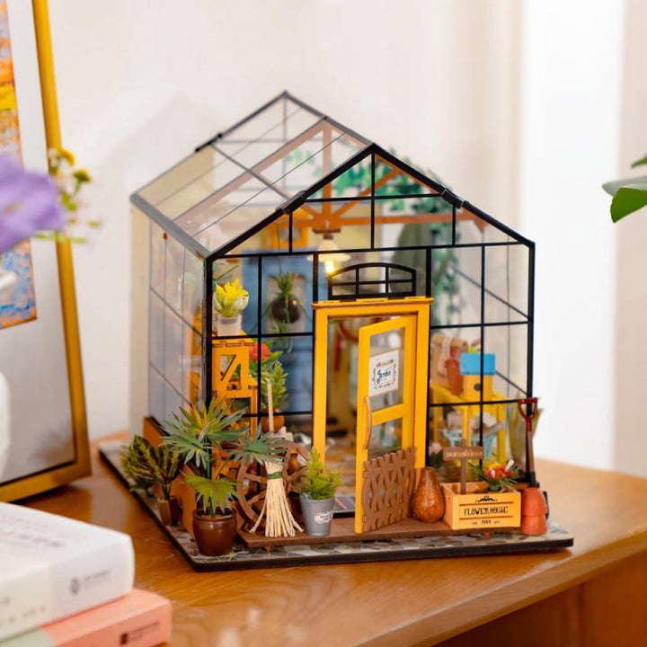 DIY miniature garden house craft kit. Unassembled wooden pieces for adult model building hobby.