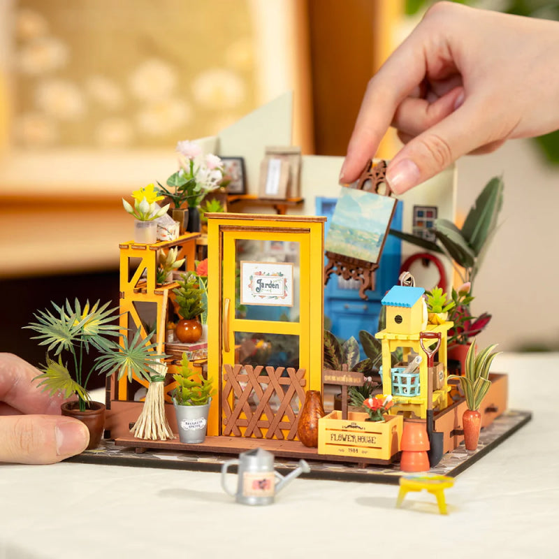 Unassembled DIY miniature garden house kit for creative model building & handmade home decor project.
