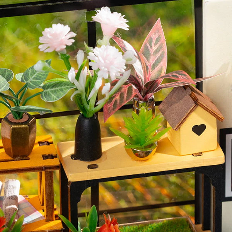 Wooden DIY kit for creating a charming miniature garden house, ideal for adult model building & decor.