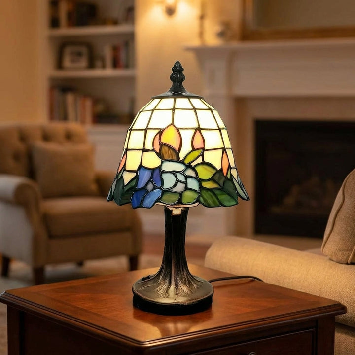 Aurafleur stained glass table lamp with floral pattern, brushed nickel base, adding decorative ambient light.