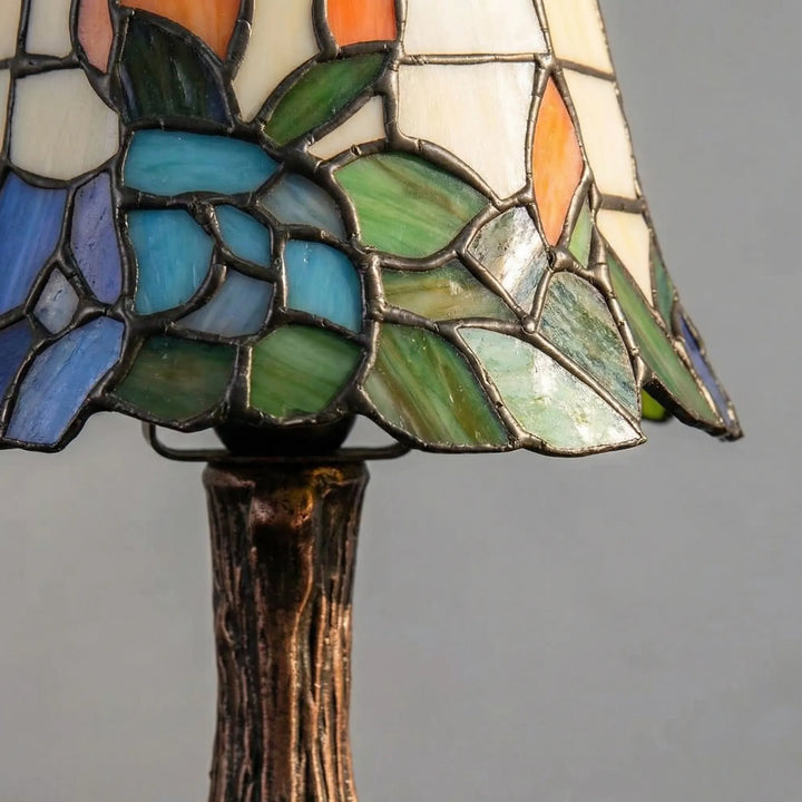 Close-up of Aurafleur stained glass table lamp, showcasing artisan craftsmanship and nickel finish for home decor.