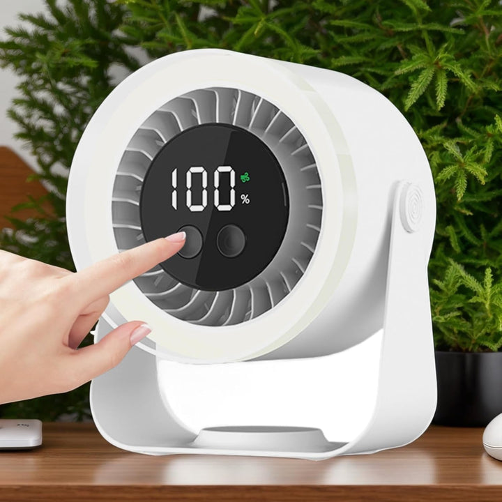 Three Auralis Quiet Desk Fans (white, black, pink) lined up, showcasing color options and portability.
