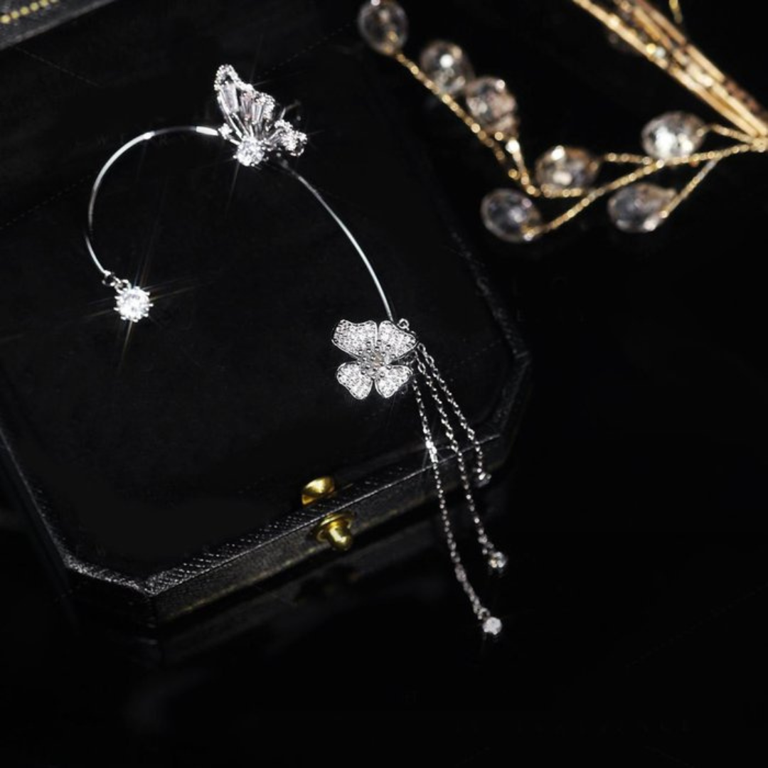 Stylized shot of women's gold butterfly drop earrings, ideal fashion accessory