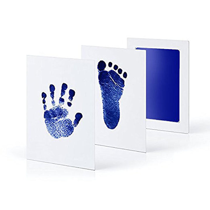 Parent and baby enjoying making precious handprints with the newborn mess-free keepsake kit.