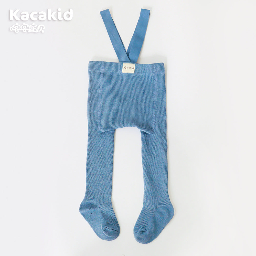Detail of the elastic waist and knit texture on these high-waisted unisex baby trousers