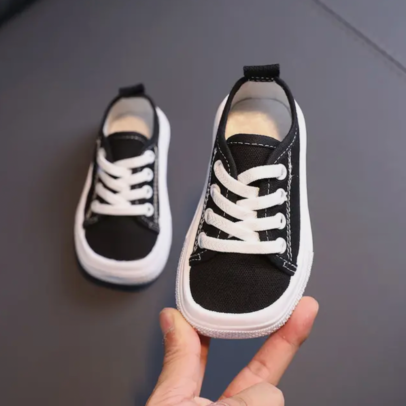 Durable kids' barefoot sneakers with flexible sole & non-slip grip for comfortable outdoor play.