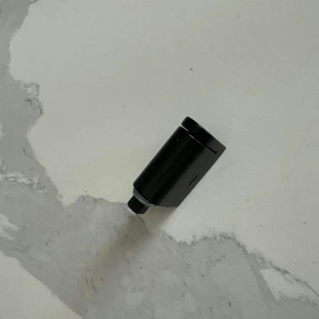 Adhesive magnetic door holder, available in black or bronze, offers drill-free installation for home safety.