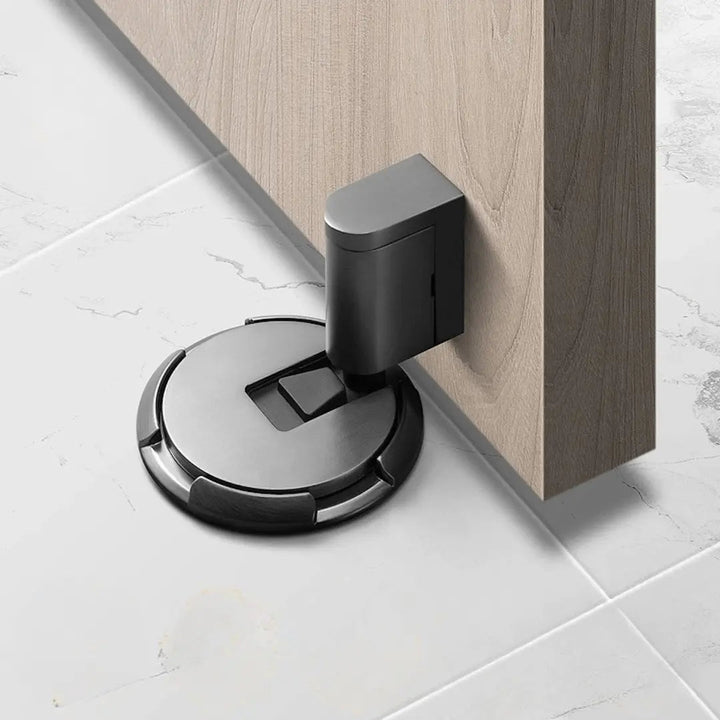 Magnetic door stop with no-drill adhesive, protects walls, holds doors open, available in black & bronze.