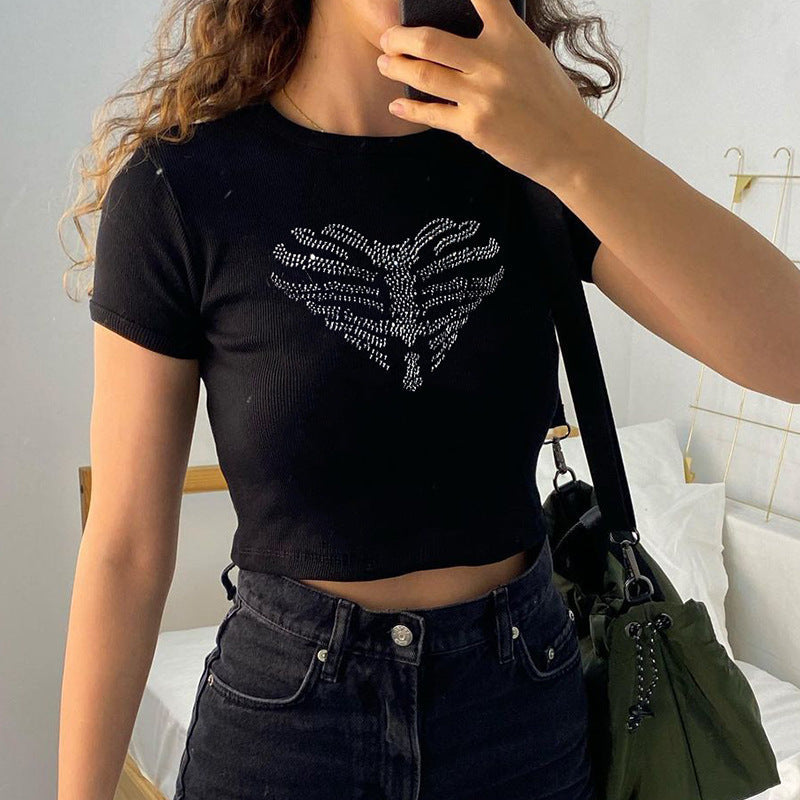 Edgy women's black crop top featuring a sparkling rhinestone skeleton design, ideal for festival fashion.