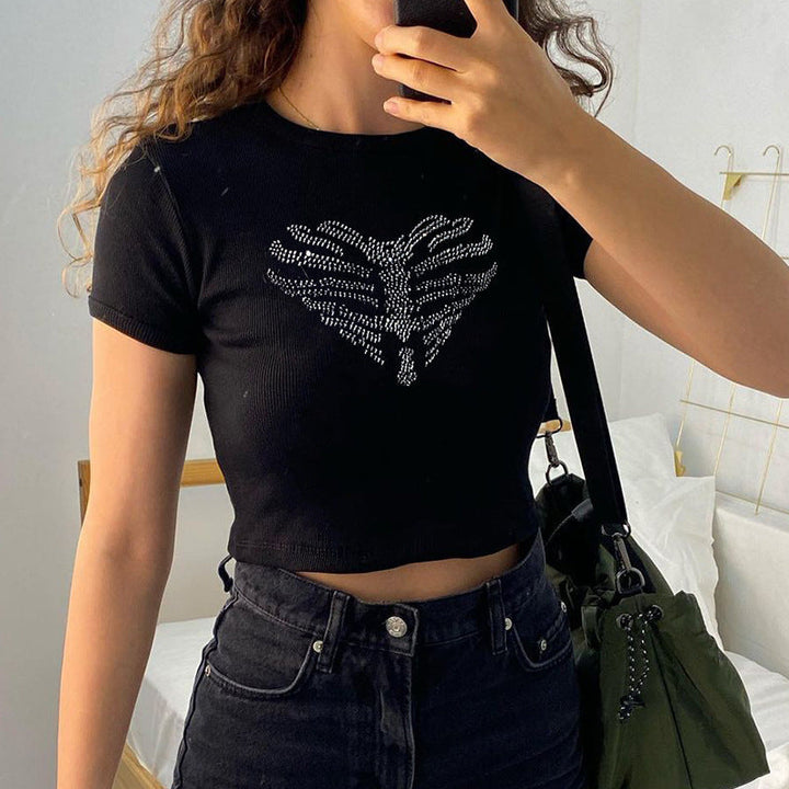 Edgy women's black crop top featuring a sparkling rhinestone skeleton design, ideal for festival fashion.