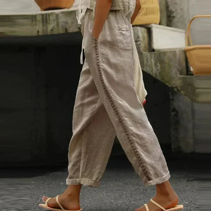 Loose fit summer trousers for women, adorned with a bold bohemian print, great for festivals and everyday casual wear.