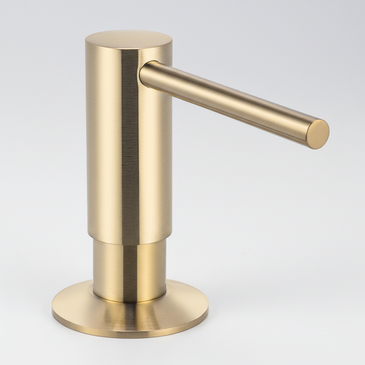 Close-up of a BrassEase built-in kitchen soap dispenser's brass pump, a chic sink organizer.