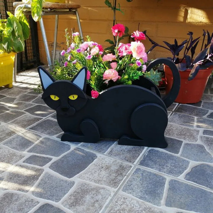 DIY garden decor with a unique cat-shaped outdoor planter, great for plants.