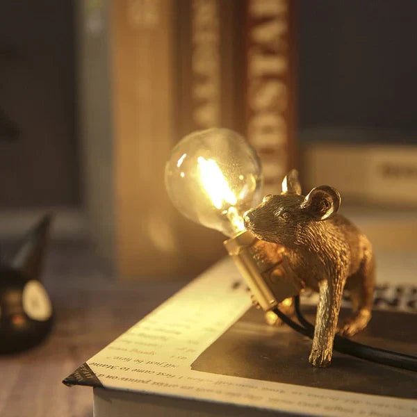 Charming gold mouse LED table lamp, a unique resin lamp blending art and light for home decor.