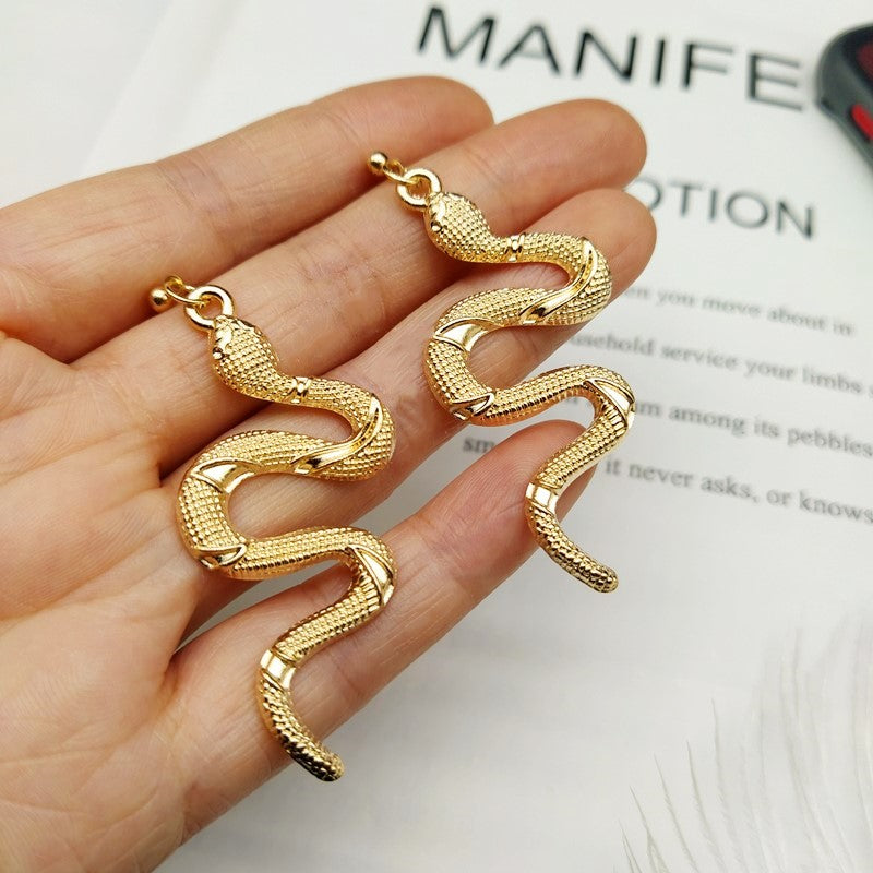 Dazzling crystal snake earrings, perfect for women seeking chic & elegant serpent jewelry.