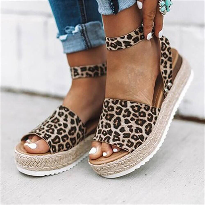Comfortable women's wedge espadrille sandals with chic ankle strap design.