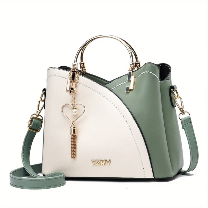 Sophisticated women's shoulder bag. Elegant faux leather versatile everyday handbag.