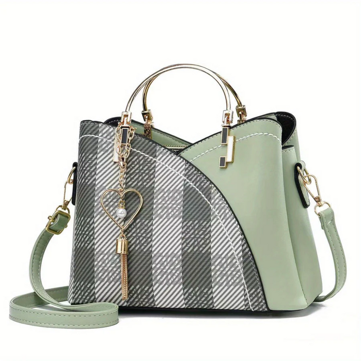 Fashionable women's everyday handbag. Elegant faux leather versatile shoulder bag.