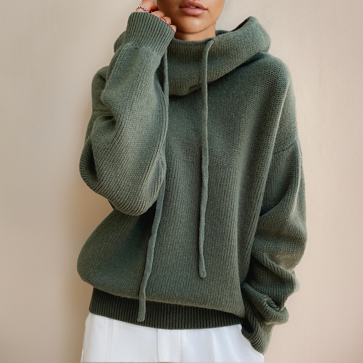 Chic women's high-neck sweater in soft Merino wool, perfect for elegant winter fashion and cozy comfort.