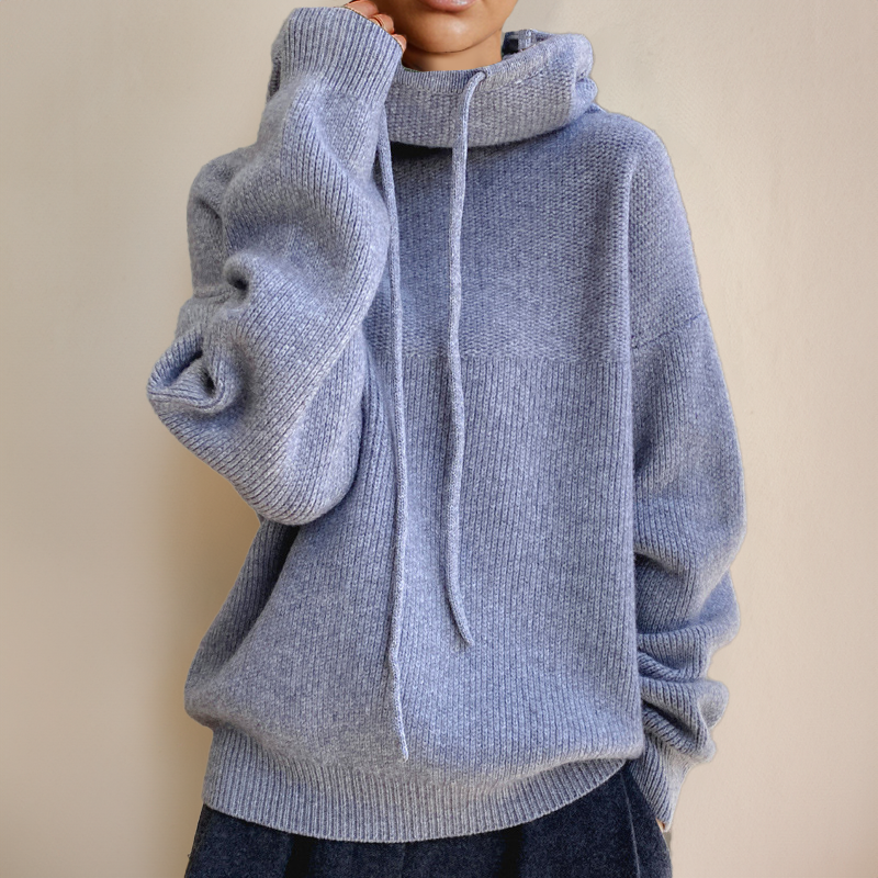 Elegant high-neck long-sleeve sweater for women, a versatile and warm Merino knit top for chic winter style.