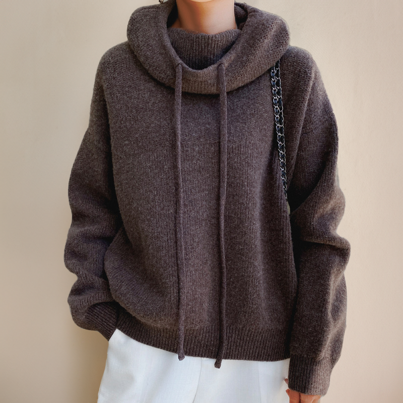 Chic women's high-neck long-sleeve knit sweater, a stylish and warm Merino wool top for winter apparel.