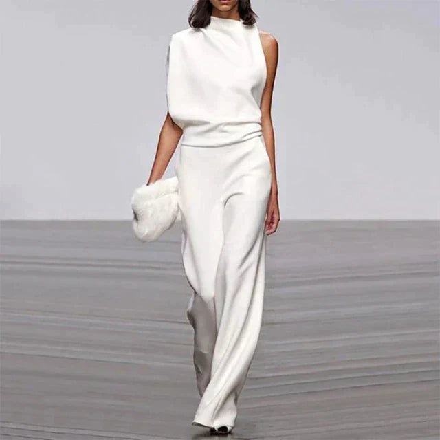 Flowy wide-leg ruffle jumpsuit for women, a comfortable and chic sleeveless design for summer parties and travel outfits.