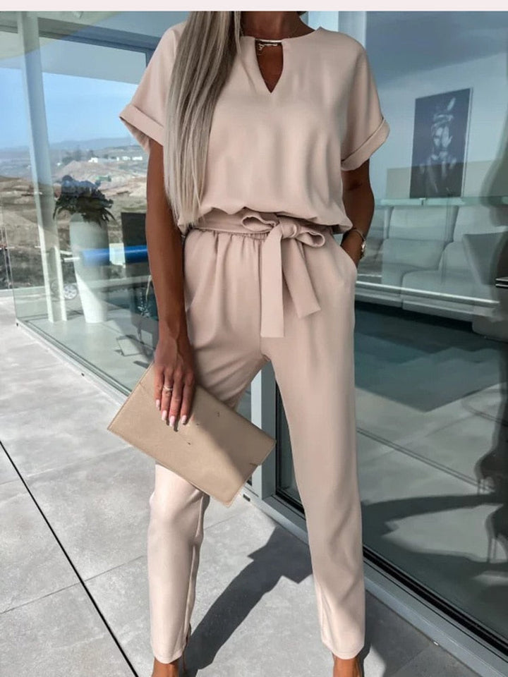 Versatile women's belted jumpsuit with short sleeves. A comfy and chic outfit for any spring or summer occasion.