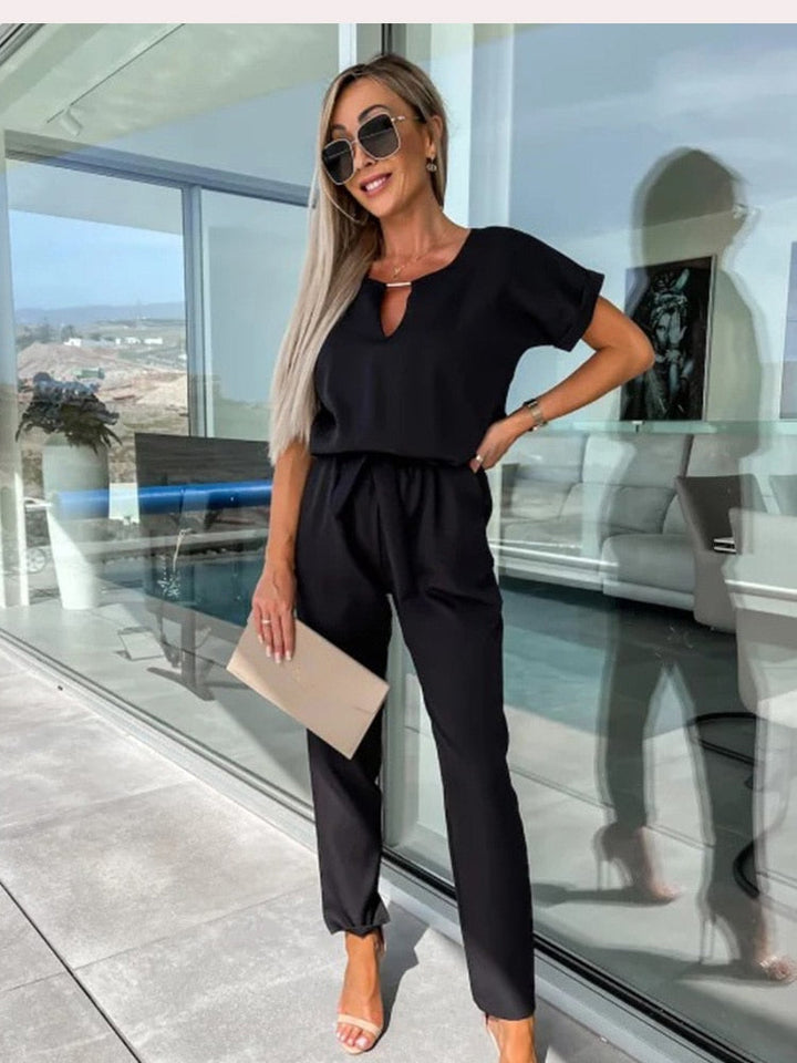 Women's short sleeve belted jumpsuit, a stylish and comfy one-piece. Perfect for versatile spring fashion.
