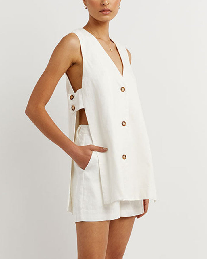Chic women's sleeveless gilet & high-waisted shorts set. Perfect two-piece summer fashion for elegant ladies.