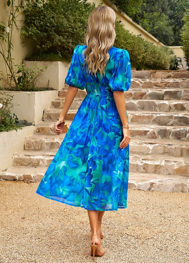 Women's V-neck summer midi dress. Chic, comfortable, flowy short-sleeve design for versatile everyday or party wear.
