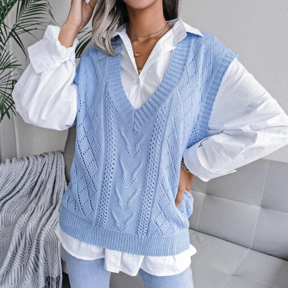 Chic women's V-neck sweater vest, perfect for versatile layering. Comfortable sleeveless knit top for modern style.