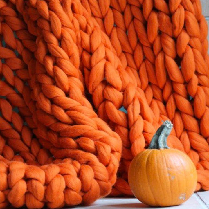 Arm knitting giant wool blend chunky yarn for soft DIY blankets, throws & cozy home decor crafting.