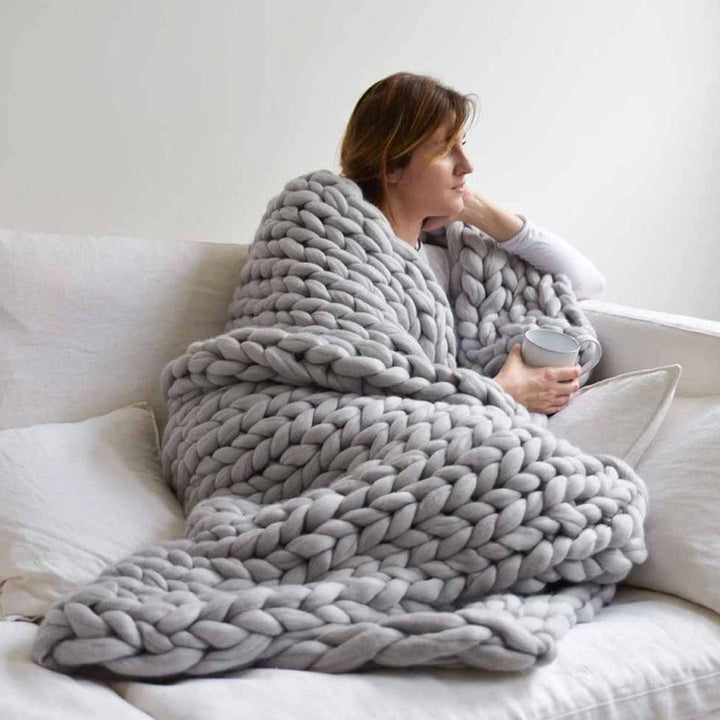 Handmade cozy living with chunky arm knitting yarn for custom DIY blankets & creative projects.