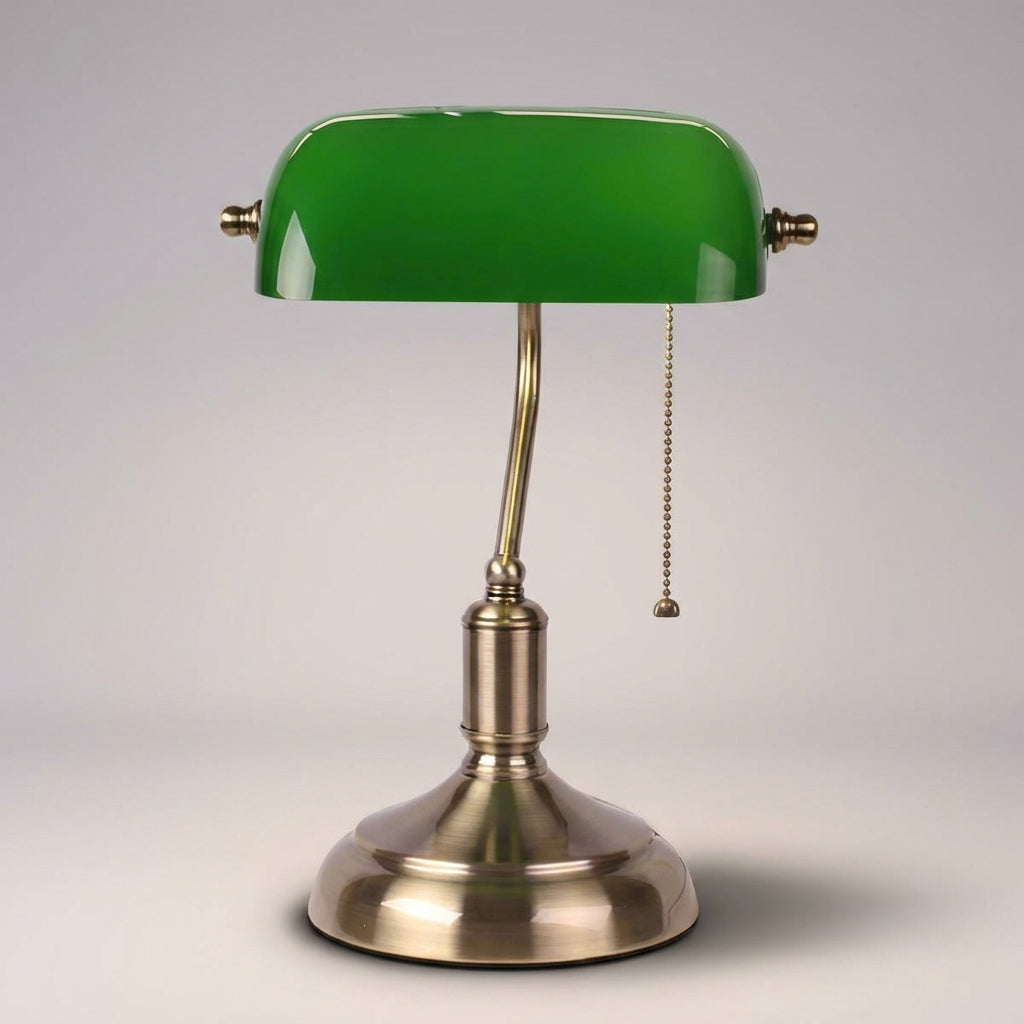 Vintage-style banker desk lamp with emerald green glass shade and polished metal base, ambient light