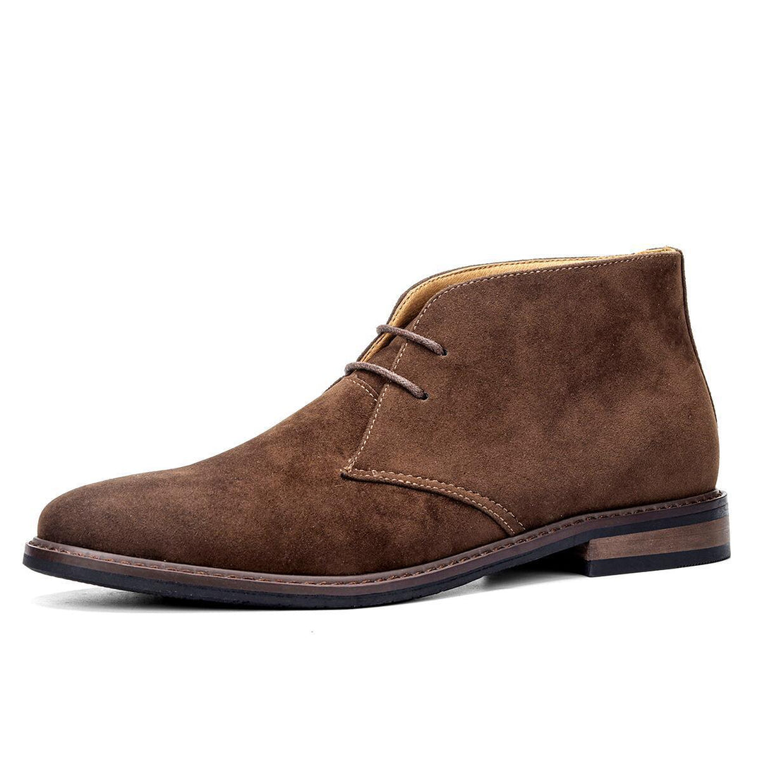 Classic men's desert boots in tan suede, offering vintage style and versatile, comfortable footwear for any occasion.