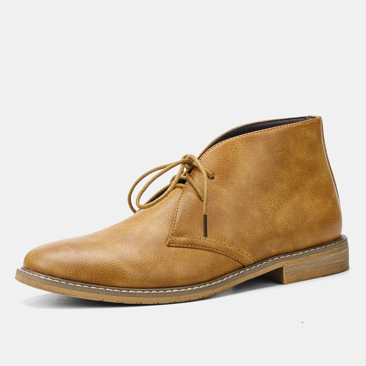 Tan men's desert boots, showcasing a comfortable, all-season design with classic vintage appeal. Ideal for men's fashion.