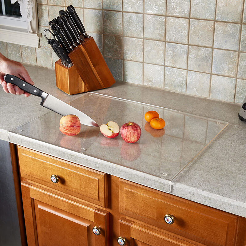 Hygienic acrylic cutting board with non-slip design; ensures safe & stable food prep.