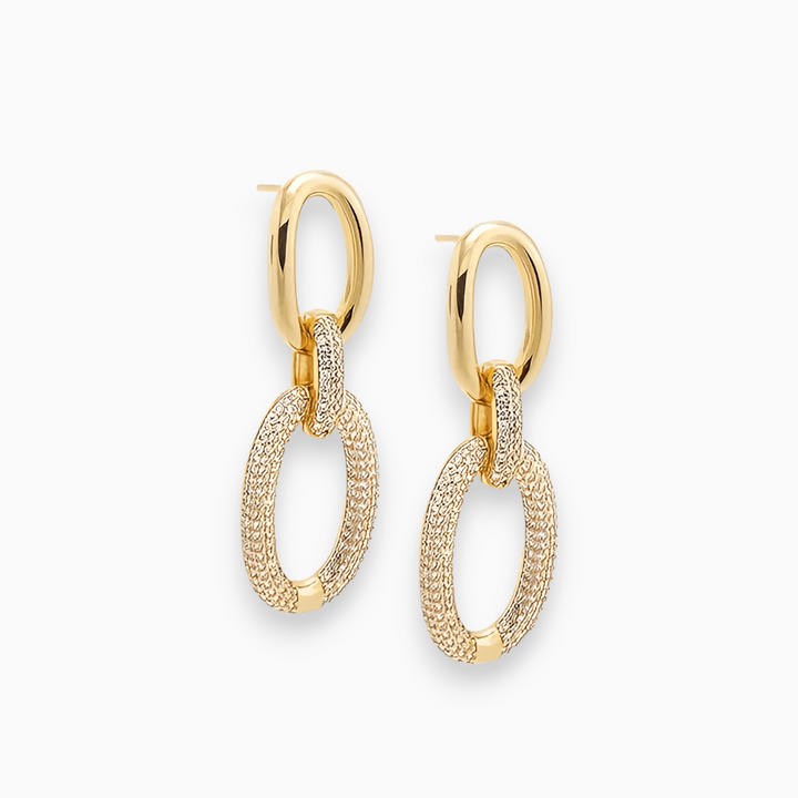Close-up of Luxe Sparkle Aurora women's stud earrings, featuring sparkling gold-plated design, perfect fashion accessory