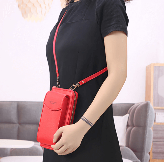 Close-up of women's compact PU leather crossbody shoulder bag with adjustable strap, sleek design.
