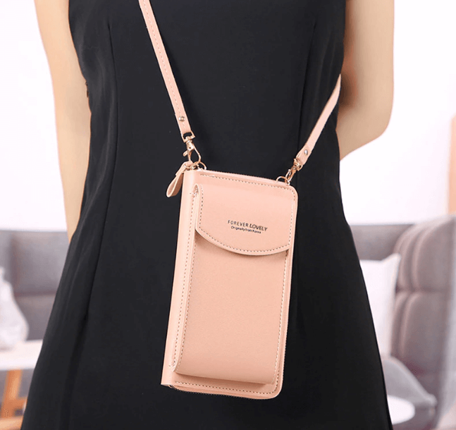 Side view of women's PU leather compact crossbody bag, adjustable shoulder strap, sleek profile.