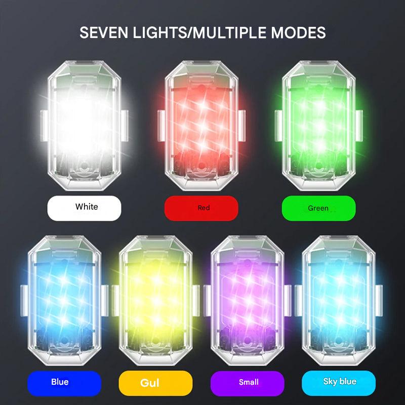Compact ColorBeam LED flashlight & safety light, multicolor visibility for outdoor activities.