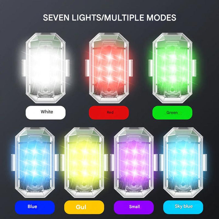Compact ColorBeam LED flashlight & safety light, multicolor visibility for outdoor activities.